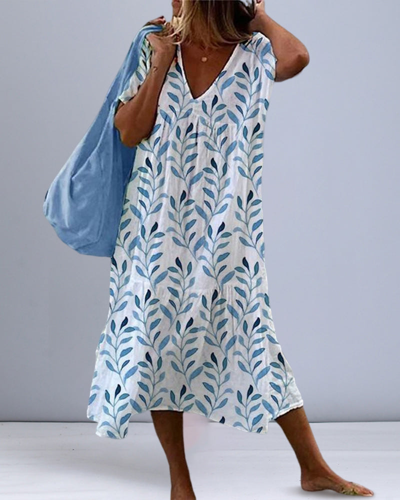 Trendigt midiklänning med bladmönster och V-urringning – Nea