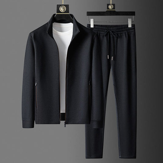 Schwarzer Herren-Trainingsanzug mit Reißverschlussjacke und Jogginghose, sportlich, elegant.