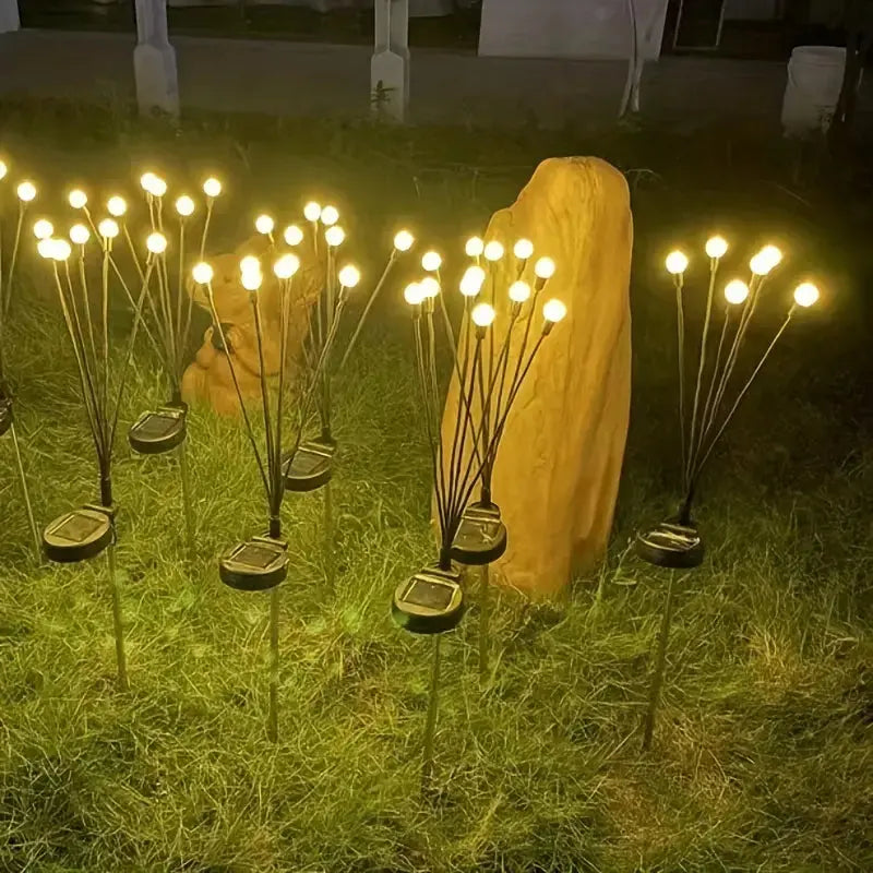 Solarbetriebene Gartenleuchten mit Erdspieß, warmweißes Licht, energiesparend, wetterfest.