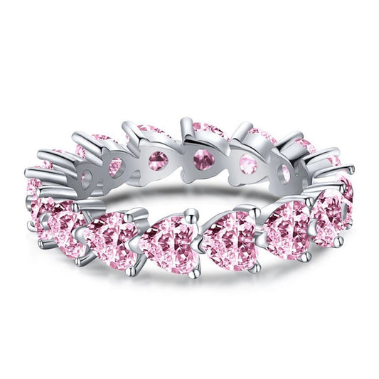 Silberring mit rosa Saphiren, Herzform, Ehering, elegantes Schmuckdesign.