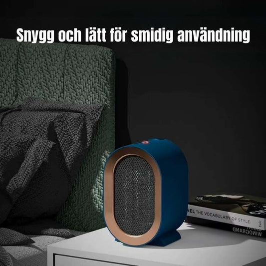 Blå värmare på ett vitt nattduksbord i ett mörkt sovrum bredvid en grön fåtölj 2