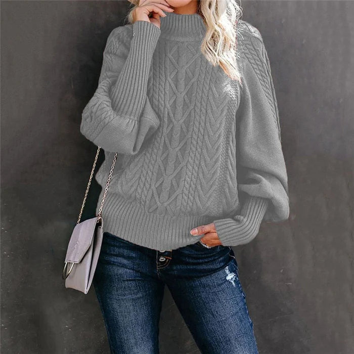 Graue Damenstrickpullover mit hohem Kragen, Zopfmuster, modisch, warm, elegant.