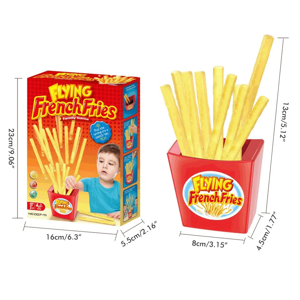Spielzeug "Flying French Fries" mit roter Verpackung, gelbe Pommes, Maße angegeben.
