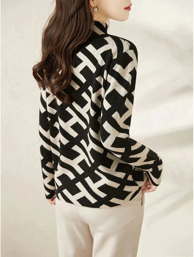 Damenpullover mit geometrischem Muster, schwarz-weiß, langärmelig, modisch, elegant.
