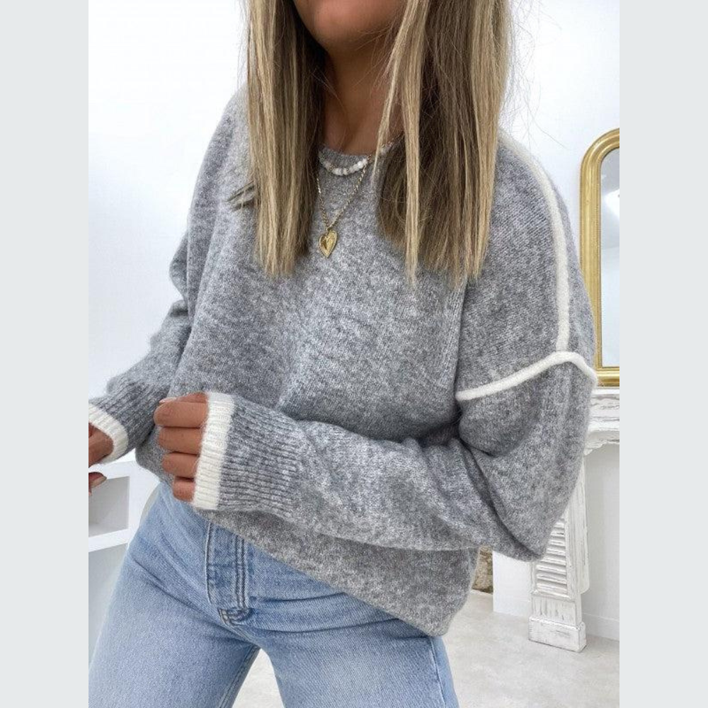 Grauer Strickpullover Damen, lässig, weiches Material, modisch, Herbstmode, gemütlich.