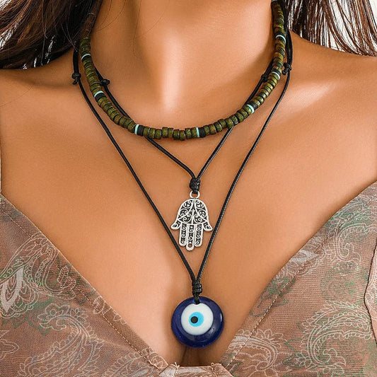 Damen Halskette Set mit Hamsa Hand und Nazar Amulett, Boho-Stil, mehrlagig, schwarz und blau.