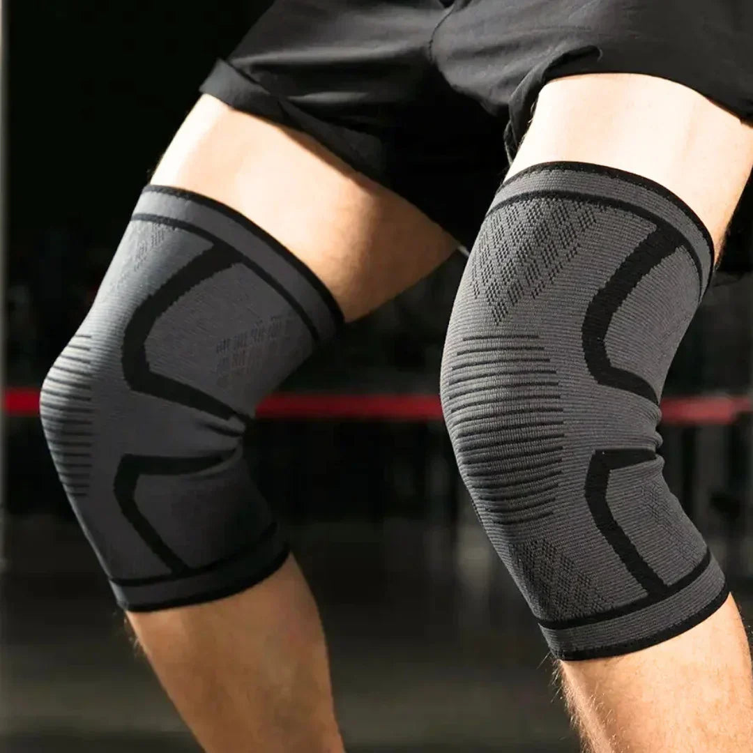 Graue Kompressions-Knieschoner für Sport, elastisch, atmungsaktiv, Unisex-Design.