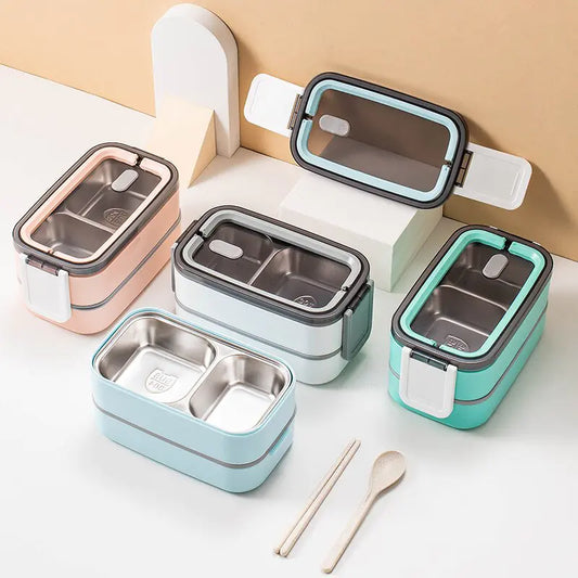 Bunte Bento-Boxen aus Edelstahl, stapelbar, mit Fächern, ideal für Mahlzeiten unterwegs.