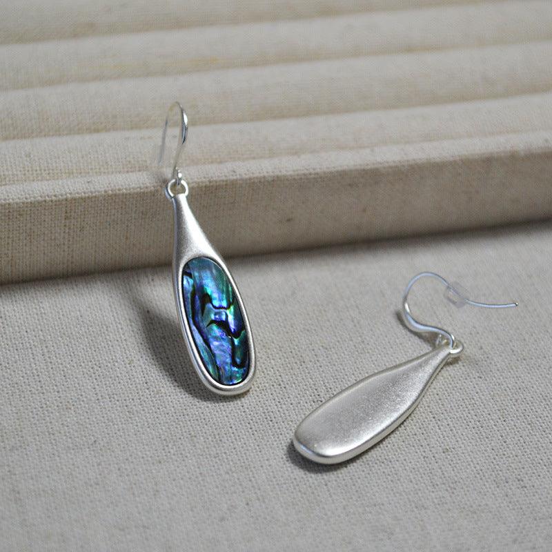 Silberne Ohrringe mit Abalone-Intarsie, elegantes Design, handgefertigter Schmuck.