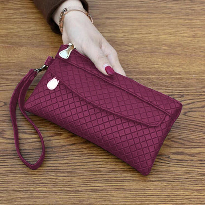 Damenhandtasche aus rotem Leder mit Rautenmuster, Reißverschluss, elegant, modisch.