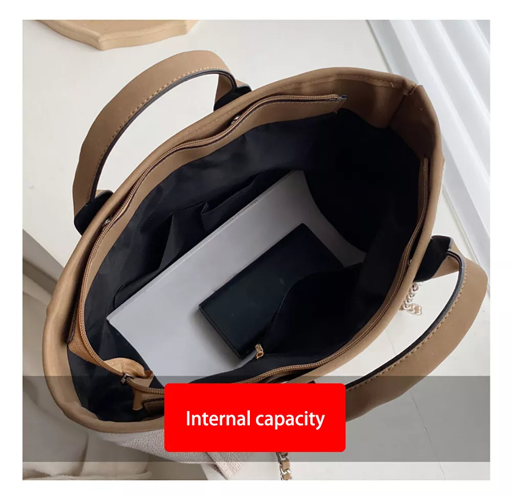 Beige Handtasche aus Leder mit großem Innenfach, ideal für Damen, stilvoll und praktisch.