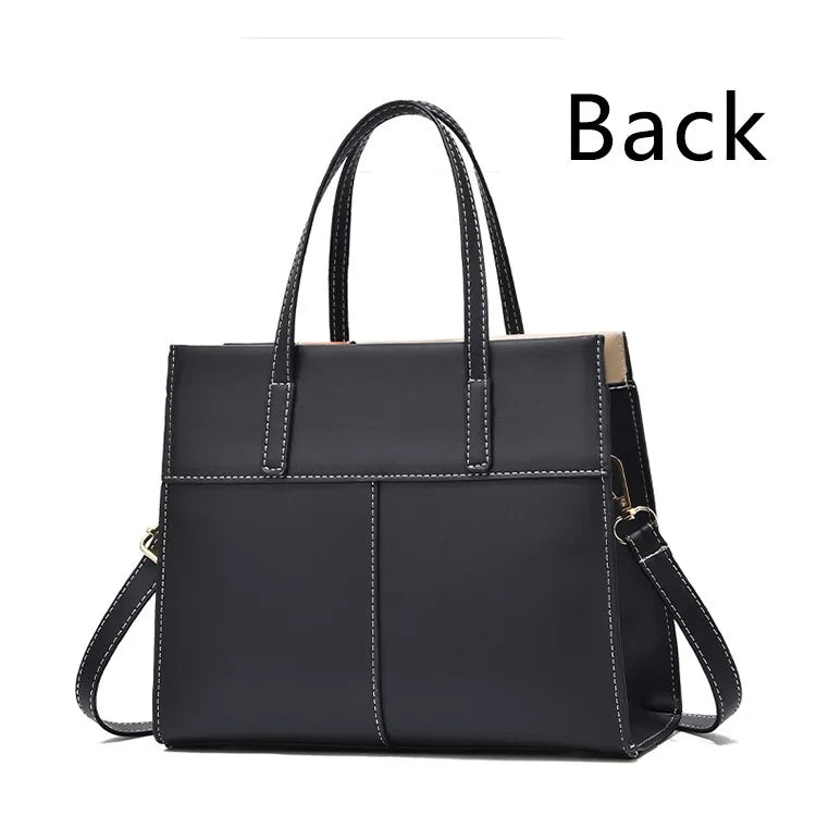 Schwarze Lederhandtasche mit Tragegriffen und Schulterriemen, elegante Damenmode.