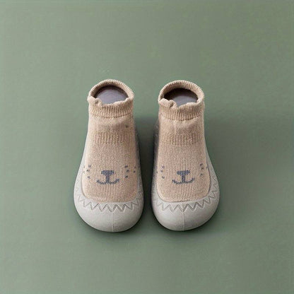 Beige Babyschuhe mit Tiermotiv, rutschfest, weiche Sohle, ideal für Kleinkinder, Unisex.