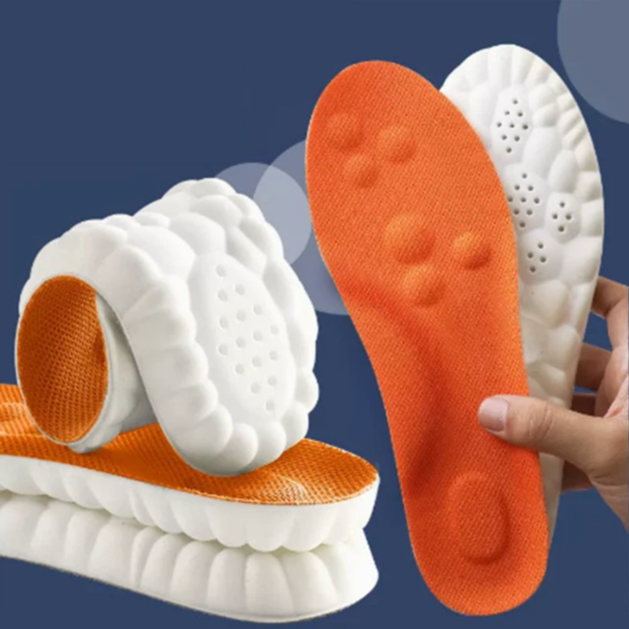 Orange und weiße orthopädische Einlegesohlen, ergonomisch, stoßdämpfend, für Sportschuhe.