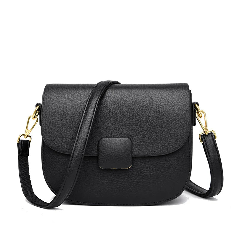 Schwarze Leder-Umhängetasche mit goldenen Details, elegante Damenhandtasche.