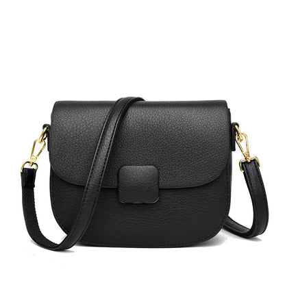 Schwarze Leder-Umhängetasche mit goldenen Details, elegante Damenhandtasche.