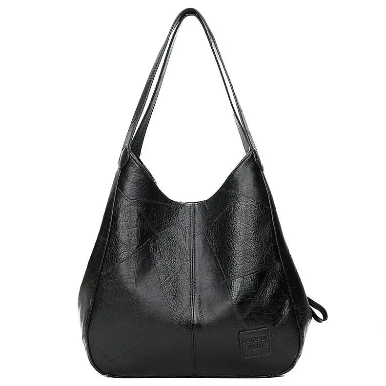 Schwarze Lederhandtasche für Damen, geräumig, modisch, mit langen Trägern, elegant.
