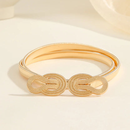Goldener Damen-Gürtel mit Knotenmuster, elegant, modisch, Accessoire für Kleider.