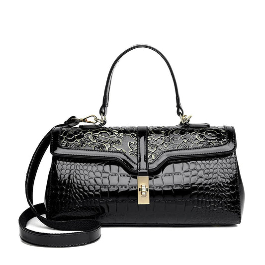 Schwarze Lederhandtasche mit Blumenmuster, Krokodilprägung, goldener Verschluss, Damenmode.