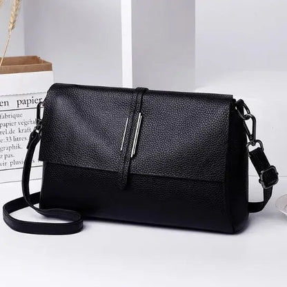 Schwarze Lederhandtasche mit verstellbarem Riemen, elegantes Design, Damenmode Accessoire.