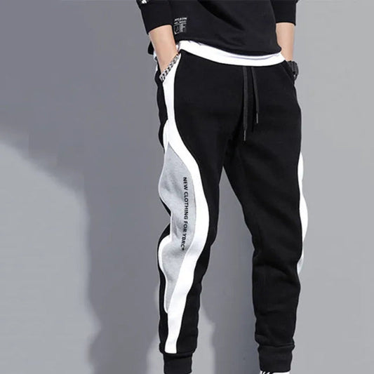 Höstliga herrpatchwork-joggers med dragsko – Rafael