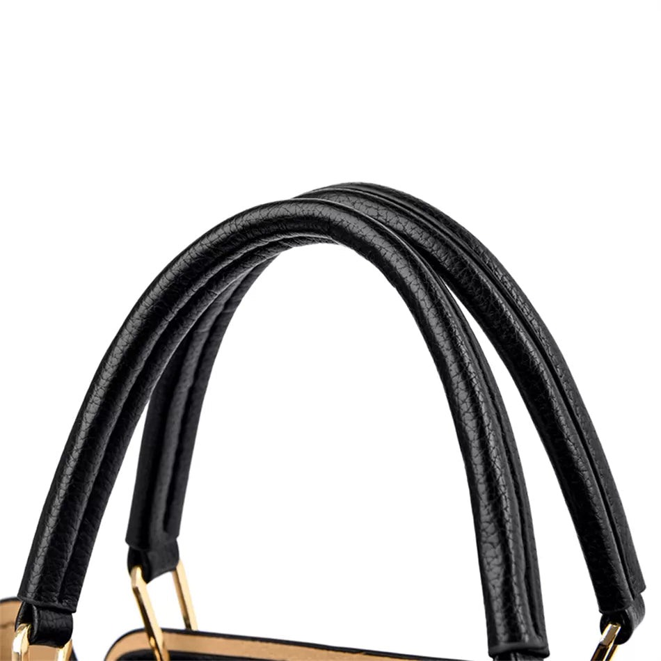 Schwarze Lederhandtasche mit goldenen Details, elegante Damenmode, luxuriöses Accessoire.