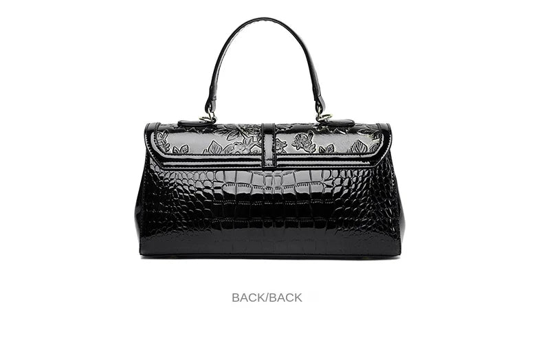 Schwarze Lederhandtasche mit Krokodilprägung, Blumenmuster, elegantes Design, Damenmode.