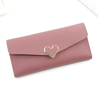 Rosa Damen-Geldbörse aus Leder mit Herzverschluss, modisch und elegant.