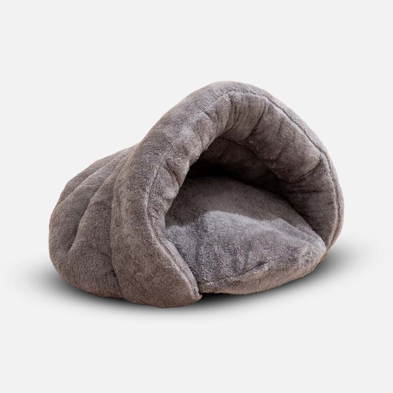 Graues, weiches Hundebett aus Plüsch, Höhlenform, gemütlich, für kleine Hunde.