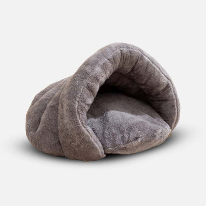 Graues, weiches Hundebett aus Plüsch, Höhlenform, gemütlich, für kleine Hunde.