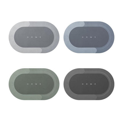Vier ovale Tischsets in Grau und Grün mit "HOME"-Aufschrift, modernes Design, rutschfest.