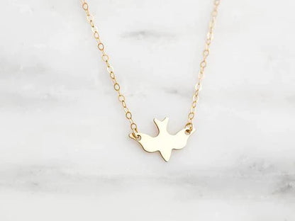 Goldene Halskette mit Taubenanhänger, filigranes Design, Damen-Schmuck, Geschenkidee.