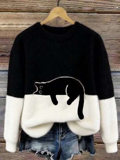 Luddig tröja i svart och vitt där den svarta katten smälter in i överdelen 5
