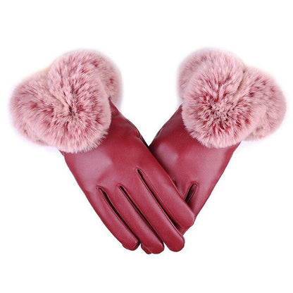 Damenhandschuhe aus rotem Leder mit rosa Kunstfellbesatz, elegant und warm.