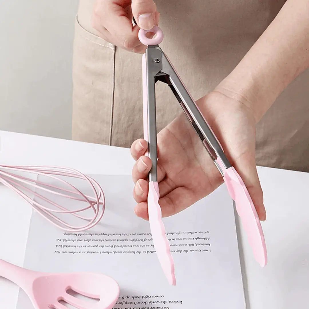 Rosa Küchenzange aus Edelstahl, hitzebeständig, ergonomisch, ideal zum Kochen und Servieren.