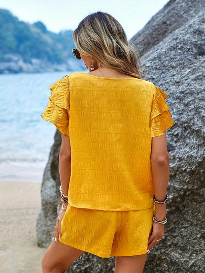 Tvådelat set med fladdermusärmar och lösa shorts – Livana
