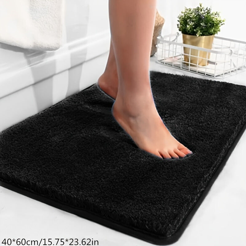 Schwarzer rutschfester Badezimmerteppich, 40x60 cm, weiches Mikrofaser-Material, Fußabdruck.