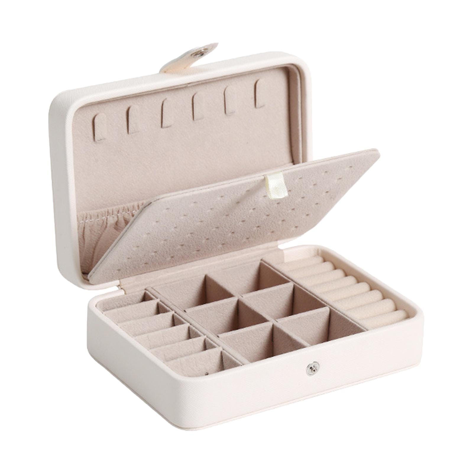 Weiße Schmuckbox aus Leder mit Fächern, ideal zur Aufbewahrung von Ringen und Ohrringen.