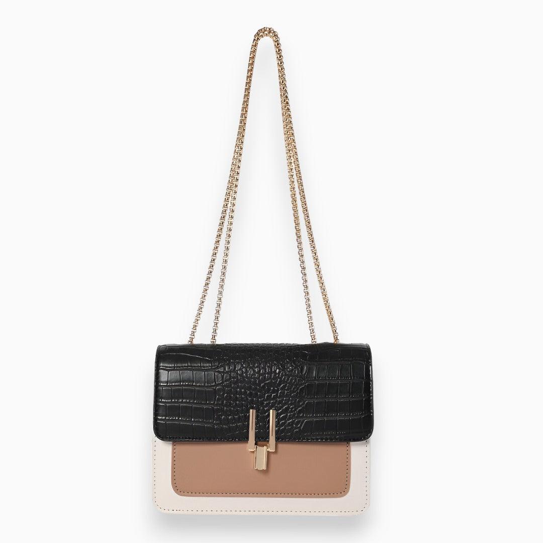 Schwarze Krokodilleder-Handtasche mit Kettenriemen, beige und weiße Details, Damenmode.