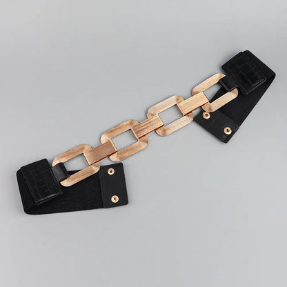 Schwarzer elastischer Gürtel mit goldener Kettenschnalle, modisches Accessoire für Damen.
