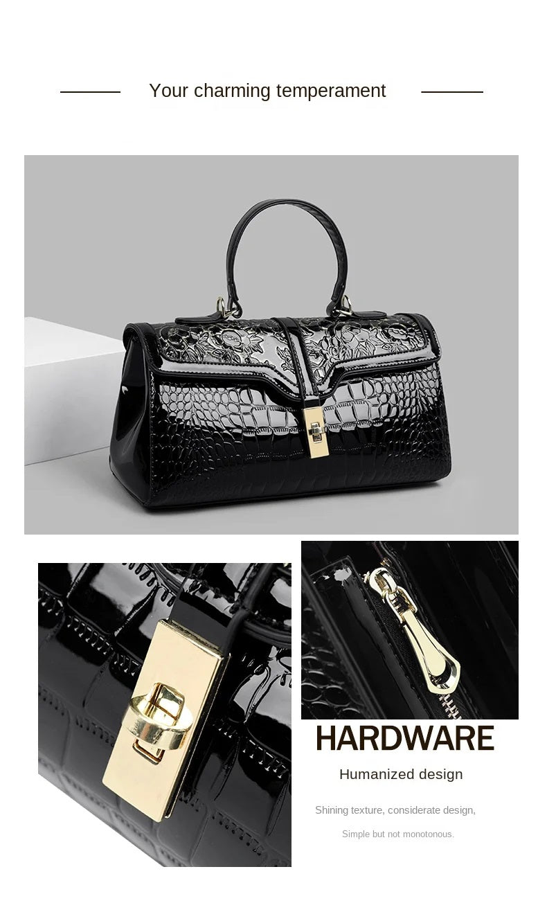 Schwarze Damenhandtasche aus Leder mit Krokodilprägung, goldener Verschluss, elegant und stilvoll.