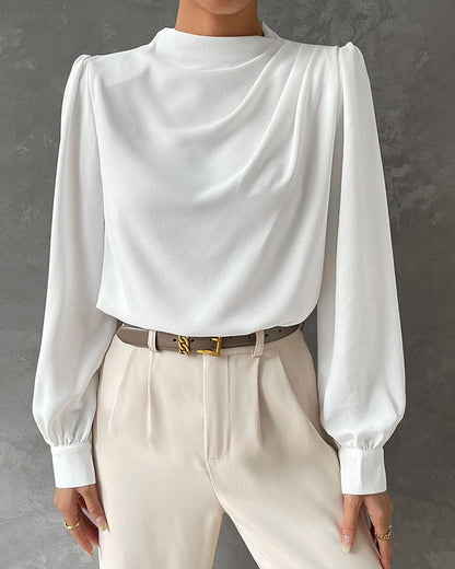 Weiße Damenbluse mit langen Ärmeln, elegantes Design, für Büro oder formelle Anlässe.
