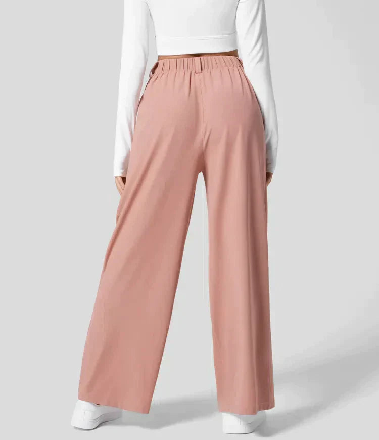Damenhose rosa, weit geschnitten, elastischer Bund, modisch, bequem, Freizeitkleidung.