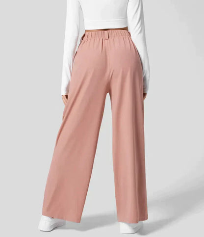 Damenhose rosa, weit geschnitten, elastischer Bund, modisch, bequem, Freizeitkleidung.