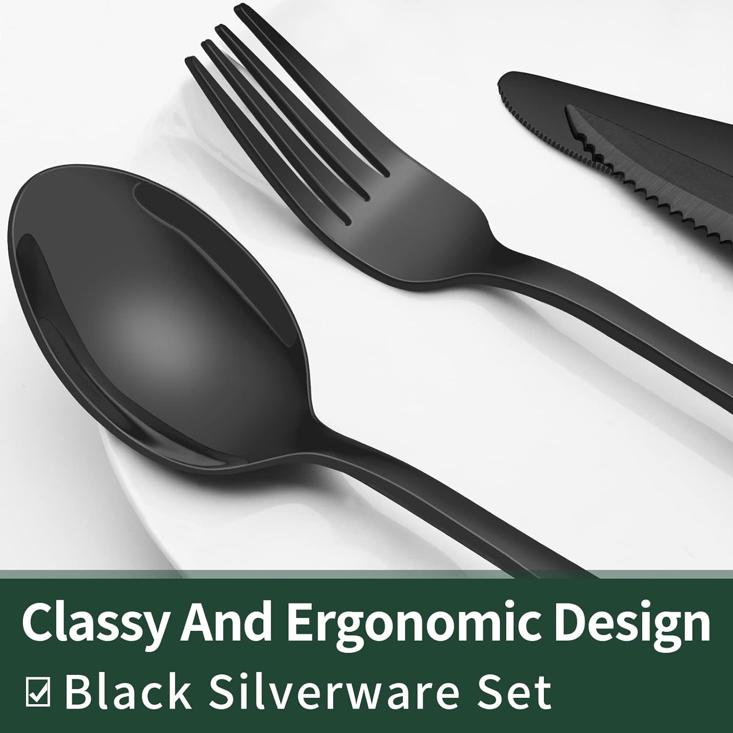 Schwarzes Besteckset aus Edelstahl, ergonomisches Design, Löffel, Gabel, Messer auf Teller.