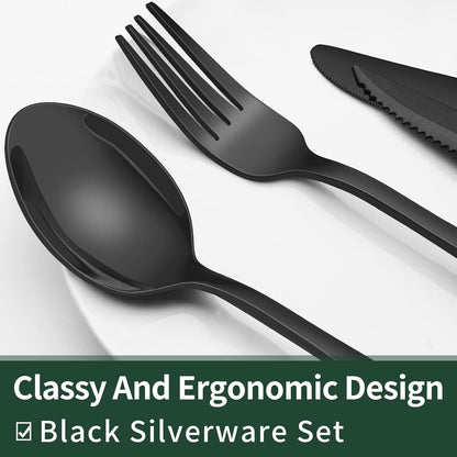 Schwarzes Besteckset aus Edelstahl, ergonomisches Design, Löffel, Gabel, Messer auf Teller.