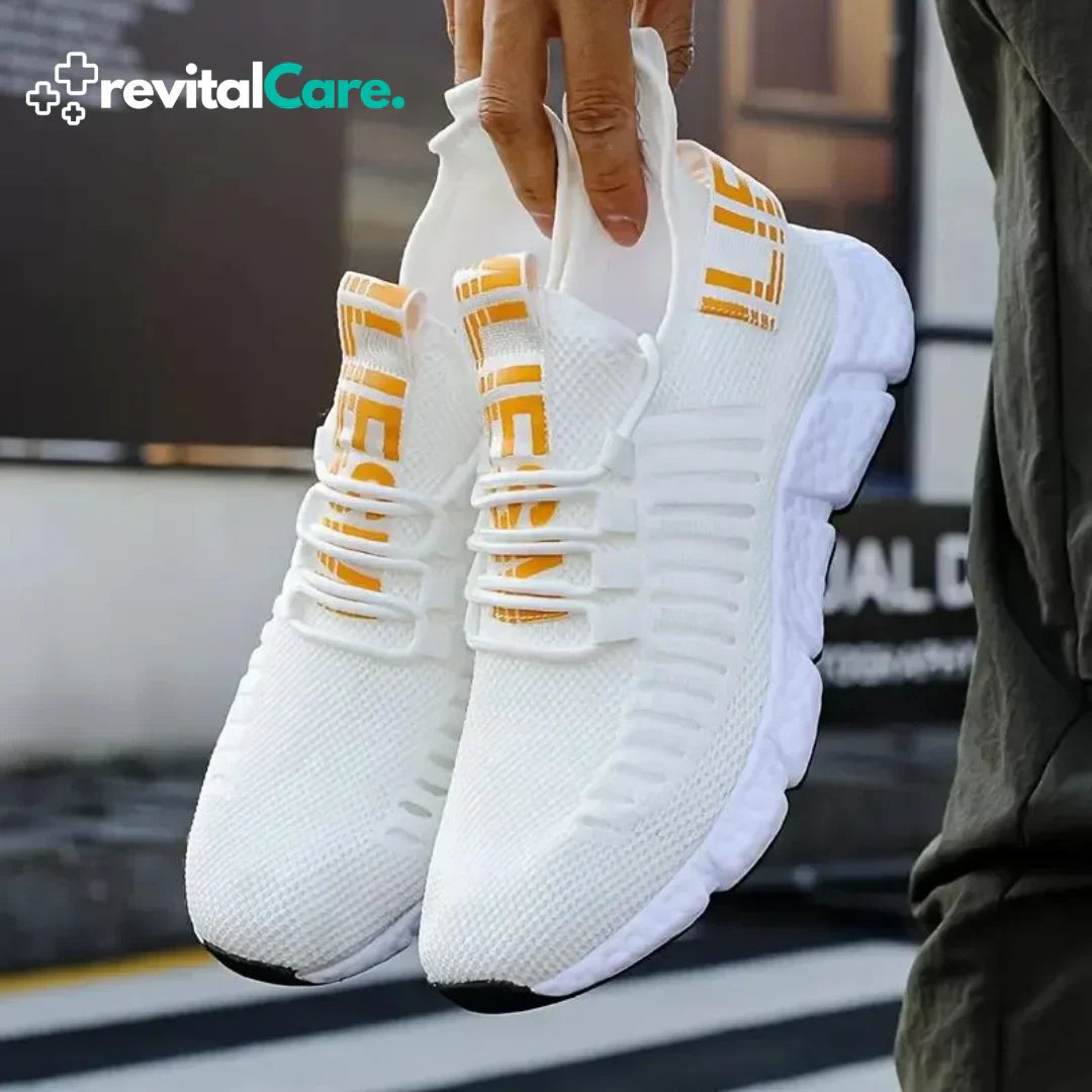Weiße Sportschuhe mit gelben Akzenten, atmungsaktives Mesh, ideal für Laufen und Fitness.