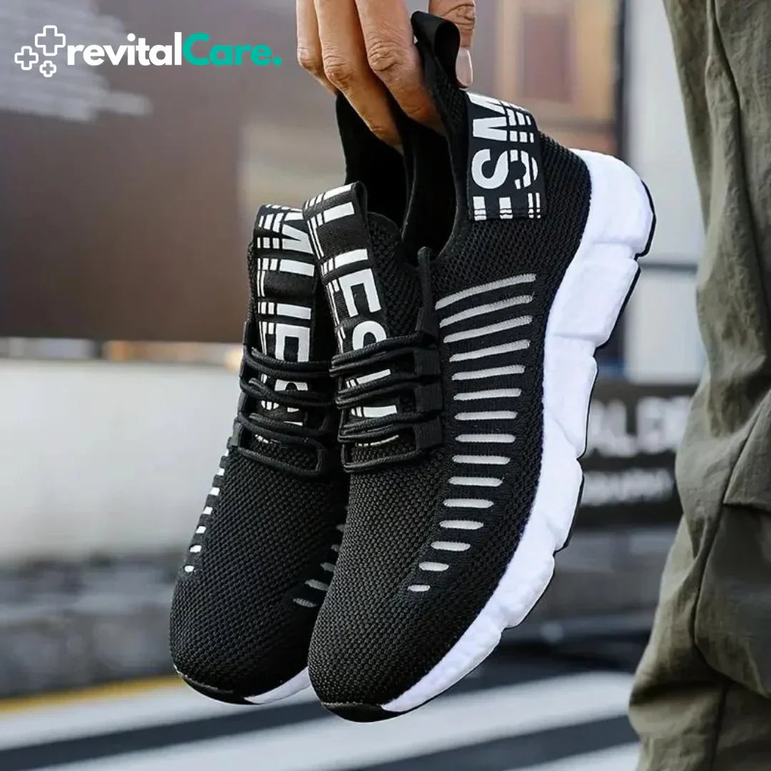 Schwarze Sportschuhe mit weißer Sohle, atmungsaktives Mesh, ideal für Laufen und Fitness.