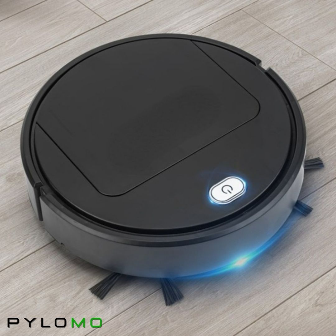 Svart robotdammsugare på ljust trägolv, lysande strömknapp och blått sken längs sidan, sedd snett uppifrån. 4