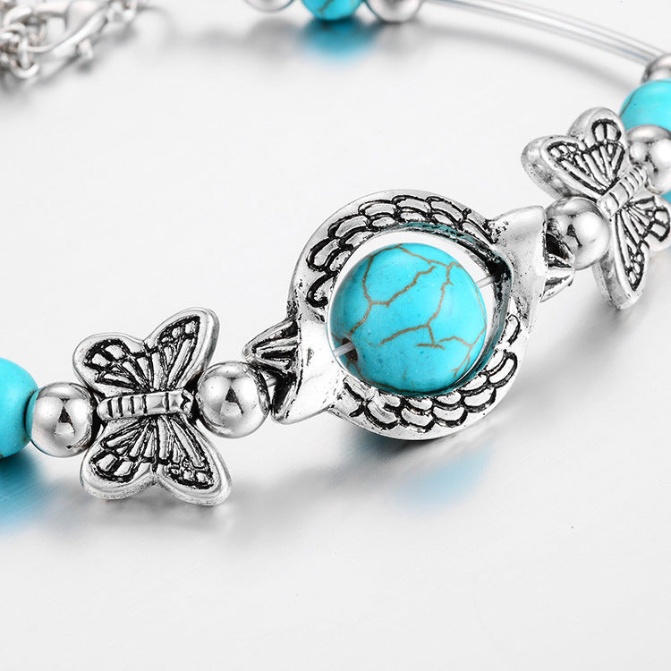 Silberarmband mit türkisfarbenem Stein und Schmetterlingsanhängern, Damen-Schmuck, modisch.